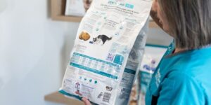 Happy Paws nurse checking pet food nutrition label